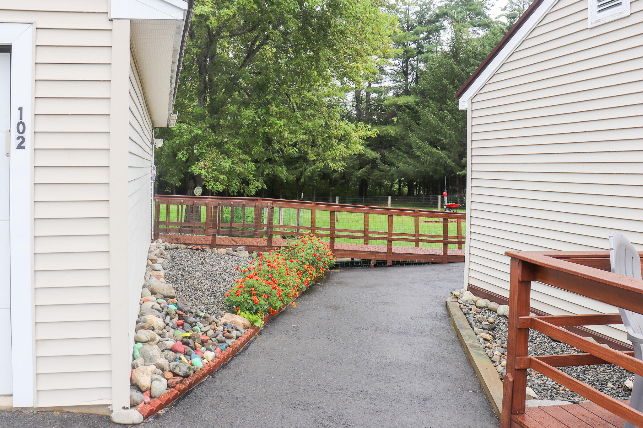 102 Shusta Road Madison, ME 04950 - Photo 56 of 61 Paved walkway between garage and house