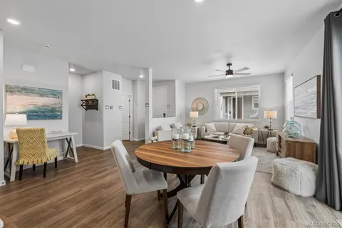 a view of a dining room with furniture and wooden floor