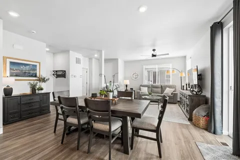 a bathroom with a granite countertop sink a toilet and a mirror