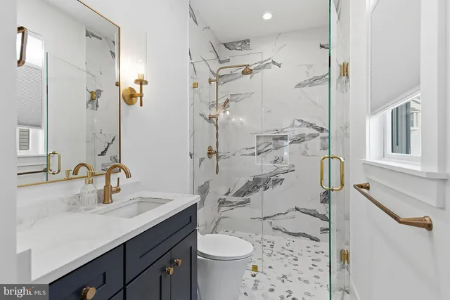 a bedroom with a bed and painting on the wall