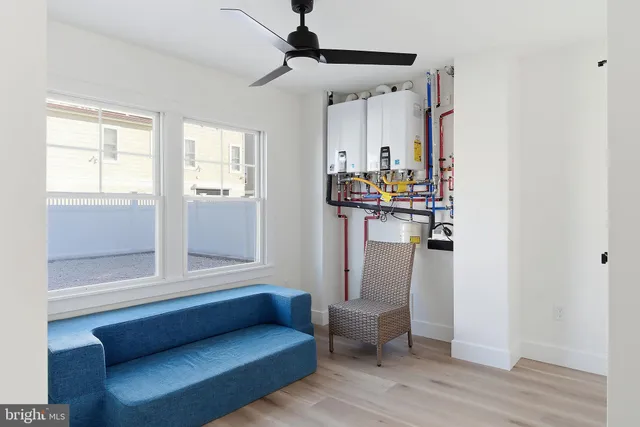 a bedroom with a bed and a ceiling fan