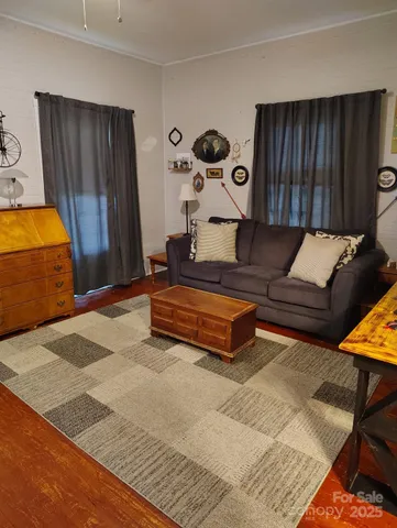a living room with furniture and a gate