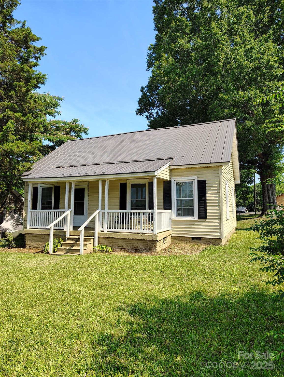8504 Moores Chapel Road Charlotte, NC 28214 - Photo 2 of 14 a front view of a house with garden and porch
