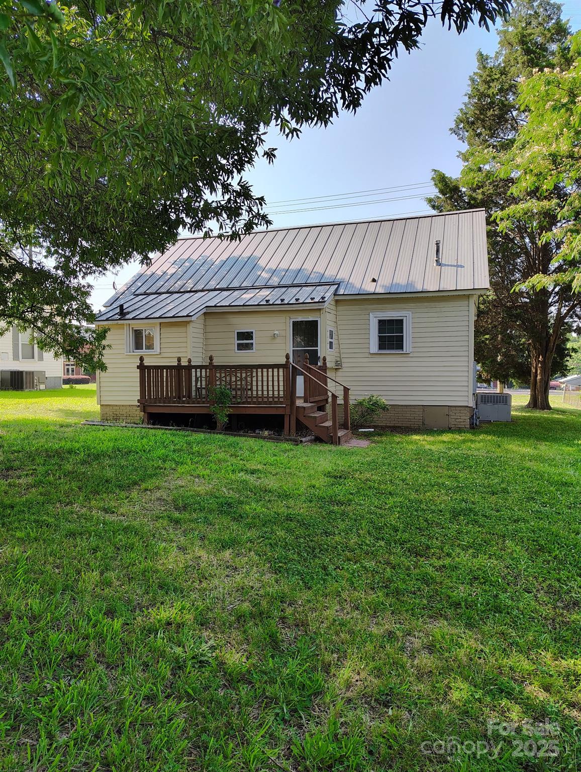 8504 Moores Chapel Road Charlotte, NC 28214 - Photo 3 of 14 a view of a house with a backyard