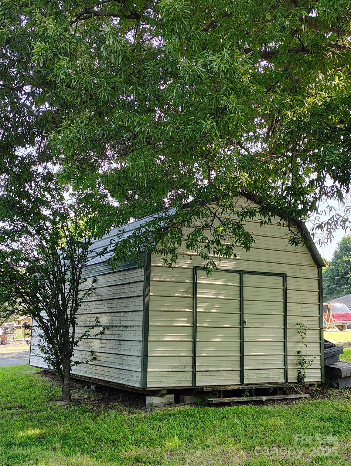8504 Moores Chapel Road Charlotte, NC 28214 - Photo 4 of 14 a view of a backyard with a large tree
