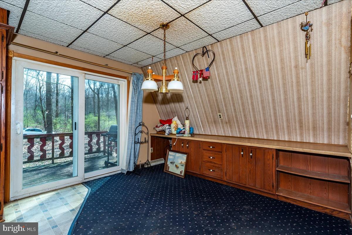 211 Mountain View Circle Denver, PA 17517 - Photo 13 of 31 a room with wooden furniture and a window