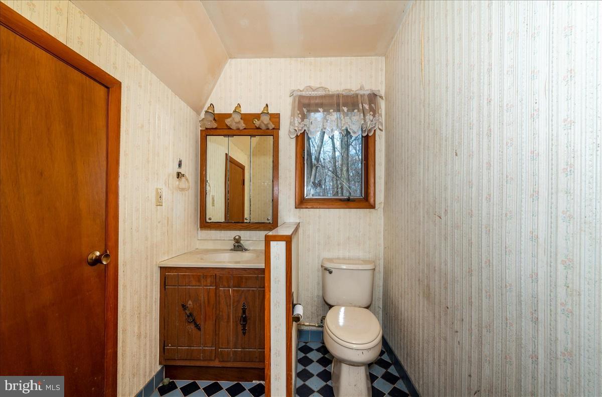 211 Mountain View Circle Denver, PA 17517 - Photo 16 of 31 a bathroom with a toilet a sink and mirror