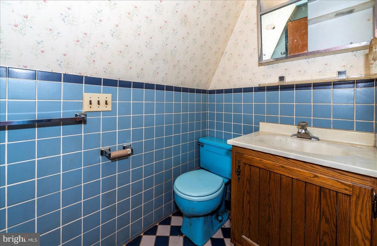 211 Mountain View Circle Denver, PA 17517 - Photo 20 of 31 a bathroom with a sink a toilet and a mirror