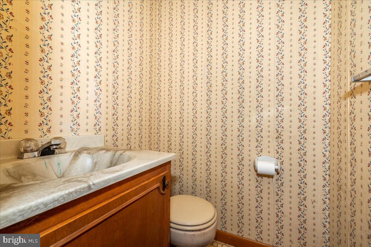 211 Mountain View Circle Denver, PA 17517 - Photo 24 of 31 a bathroom with a granite countertop sink toilet and a mirror