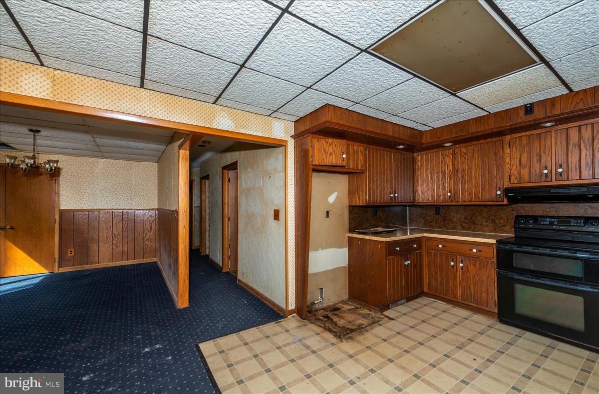 211 Mountain View Circle Denver, PA 17517 - Photo 8 of 31 a kitchen with stainless steel appliances granite countertop a refrigerator and wooden cabinets