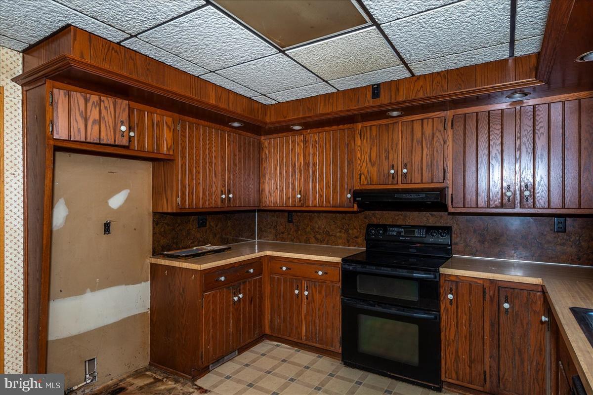 211 Mountain View Circle Denver, PA 17517 - Photo 10 of 31 a kitchen with kitchen island granite countertop a sink stainless steel appliances and cabinets