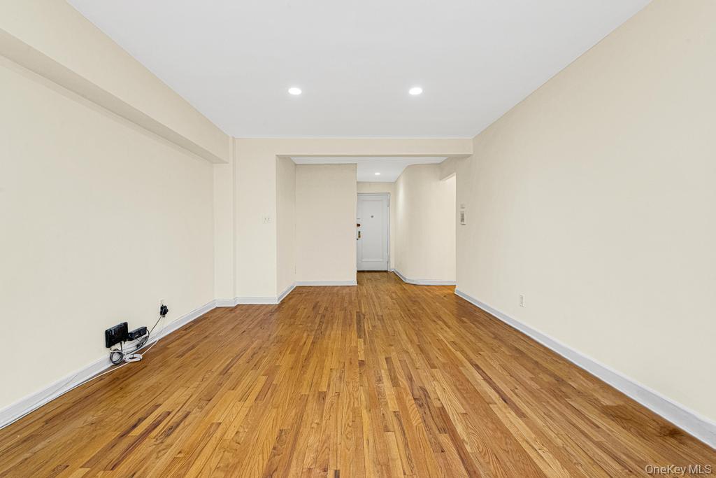 72-10 112th Street, Unit 5B Queens, NY 11375 - Photo 11 of 27 a view of empty room with wooden floor
