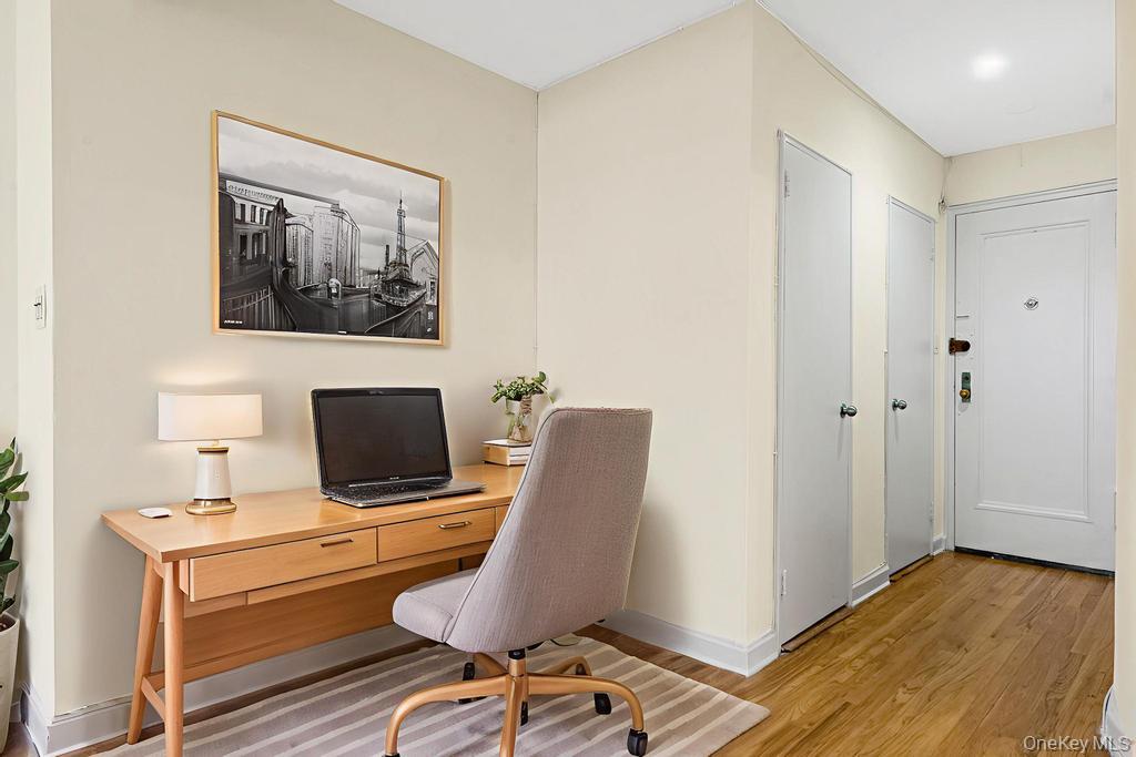 72-10 112th Street, Unit 5B Queens, NY 11375 - Photo 6 of 27 a view of a workspace with furniture and a window