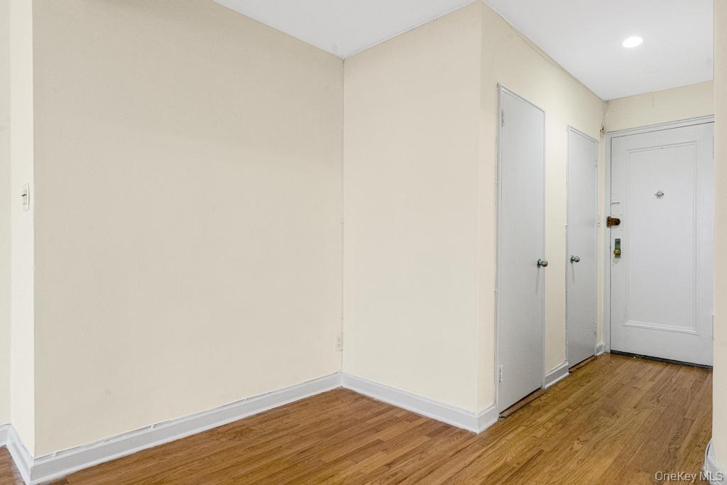 72-10 112th Street, Unit 5B Queens, NY 11375 - Photo 7 of 27 a view of an empty room with wooden floor