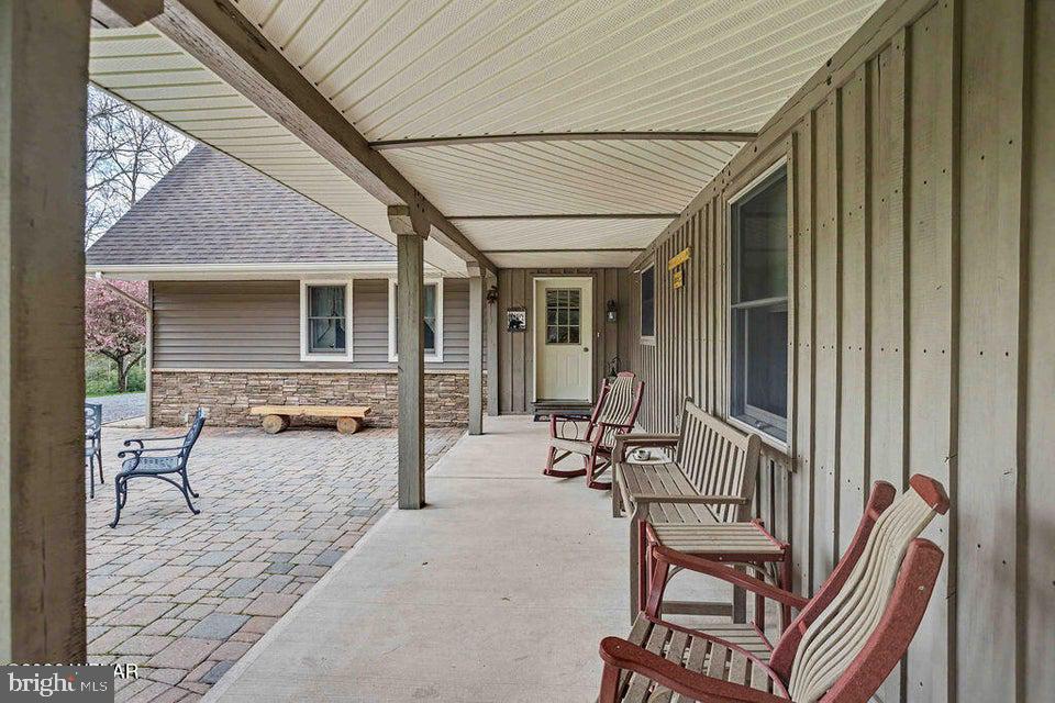 2270 Pine Tree Road Hughesville, PA 17737 - Photo 13 of 90 Charming porch with inviting seating.