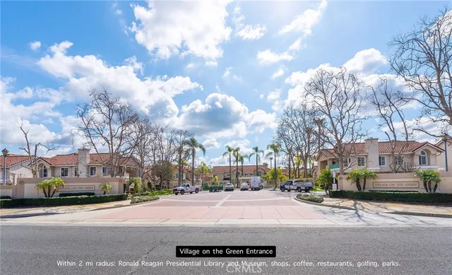a city street lined with buildings and trees