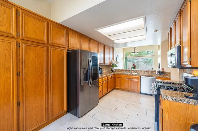 a large kitchen with a large window