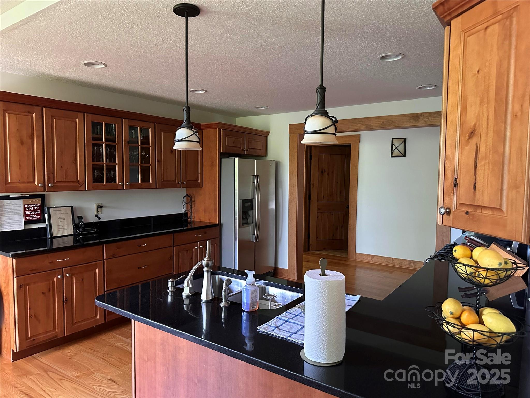 66 Boone Cove Road Zirconia, NC 28790 - Photo 14 of 15 a kitchen with sink refrigerator and dining table