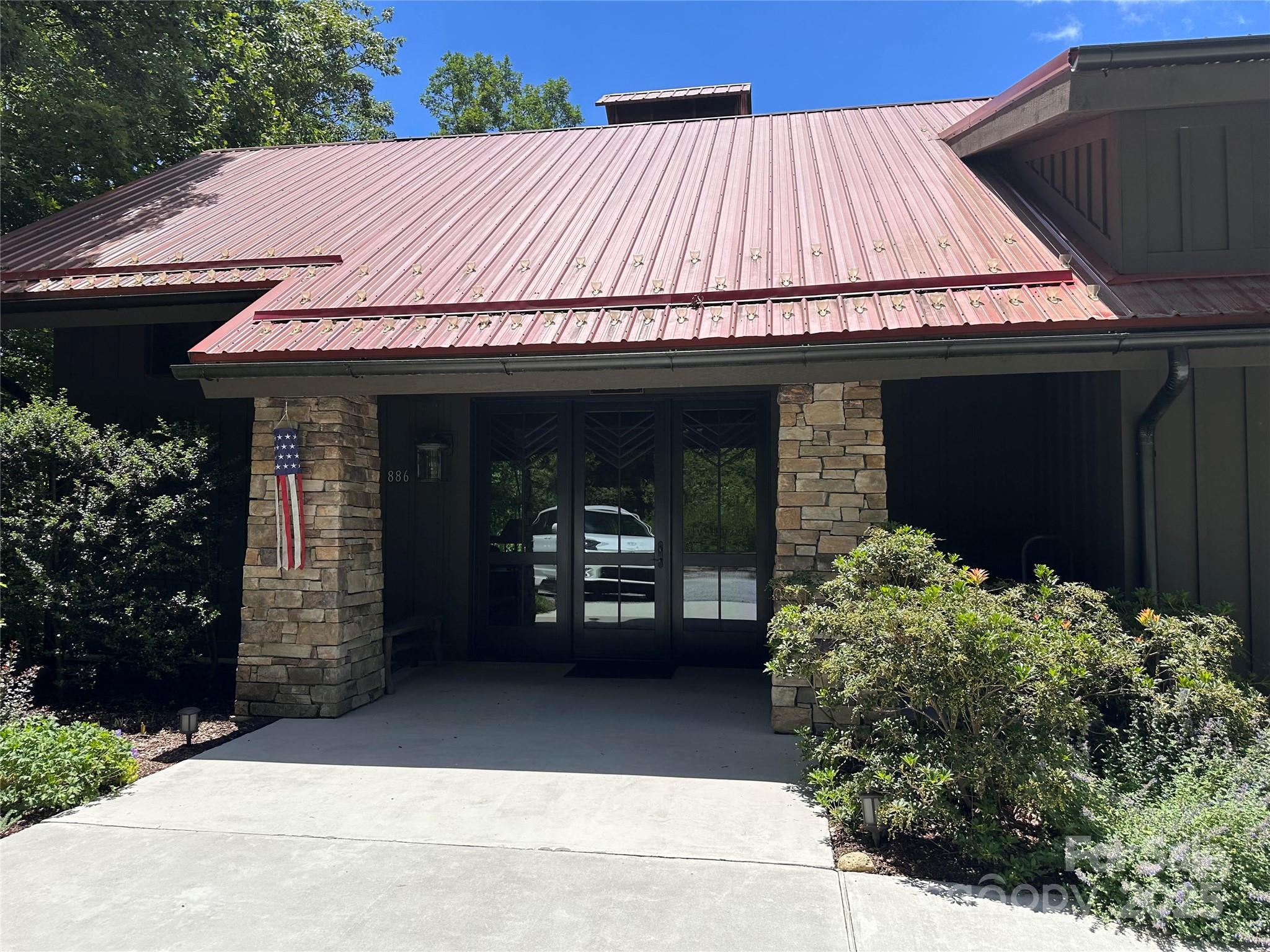 66 Boone Cove Road Zirconia, NC 28790 - Photo 10 of 15 a front view of a house with a porch