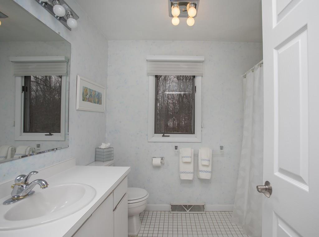 30 Aspen Road Sharon, MA 02067 - Photo 14 of 24 a bathroom with a sink a toilet and shower