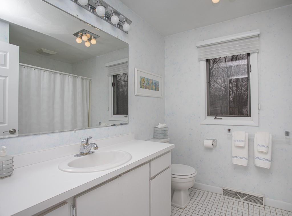 30 Aspen Road Sharon, MA 02067 - Photo 15 of 24 a bathroom with a toilet a sink and mirror