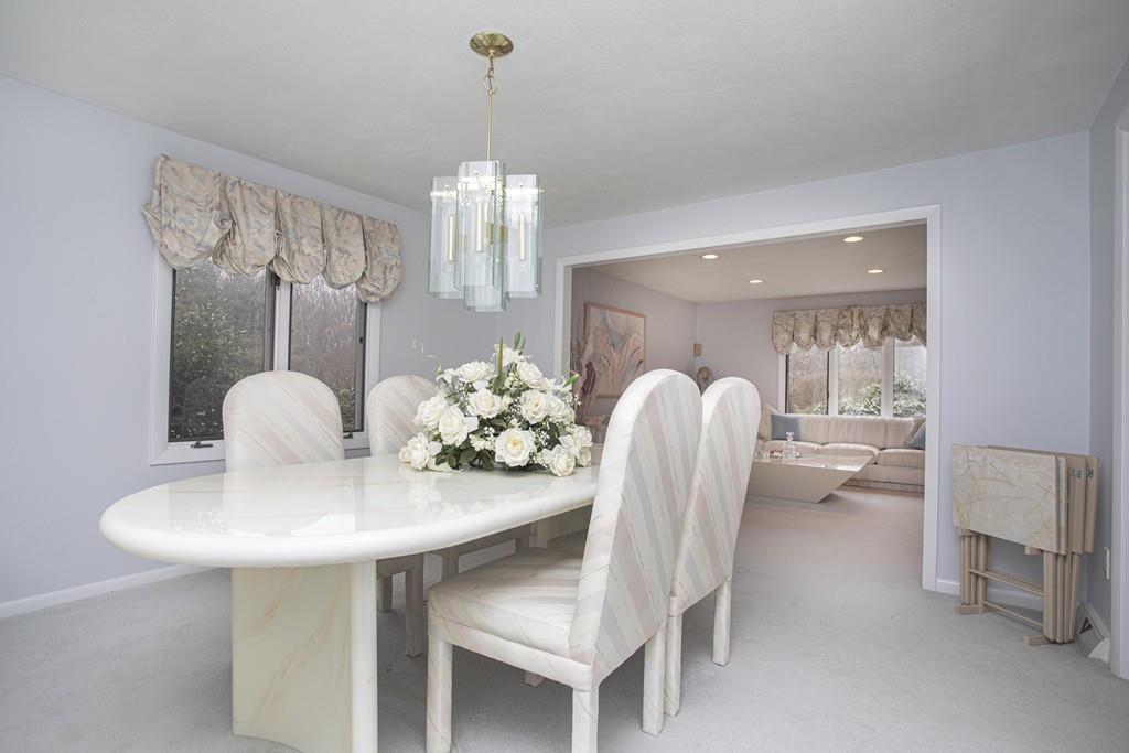 30 Aspen Road Sharon, MA 02067 - Photo 6 of 24 a view of a dining room with furniture and chandelier