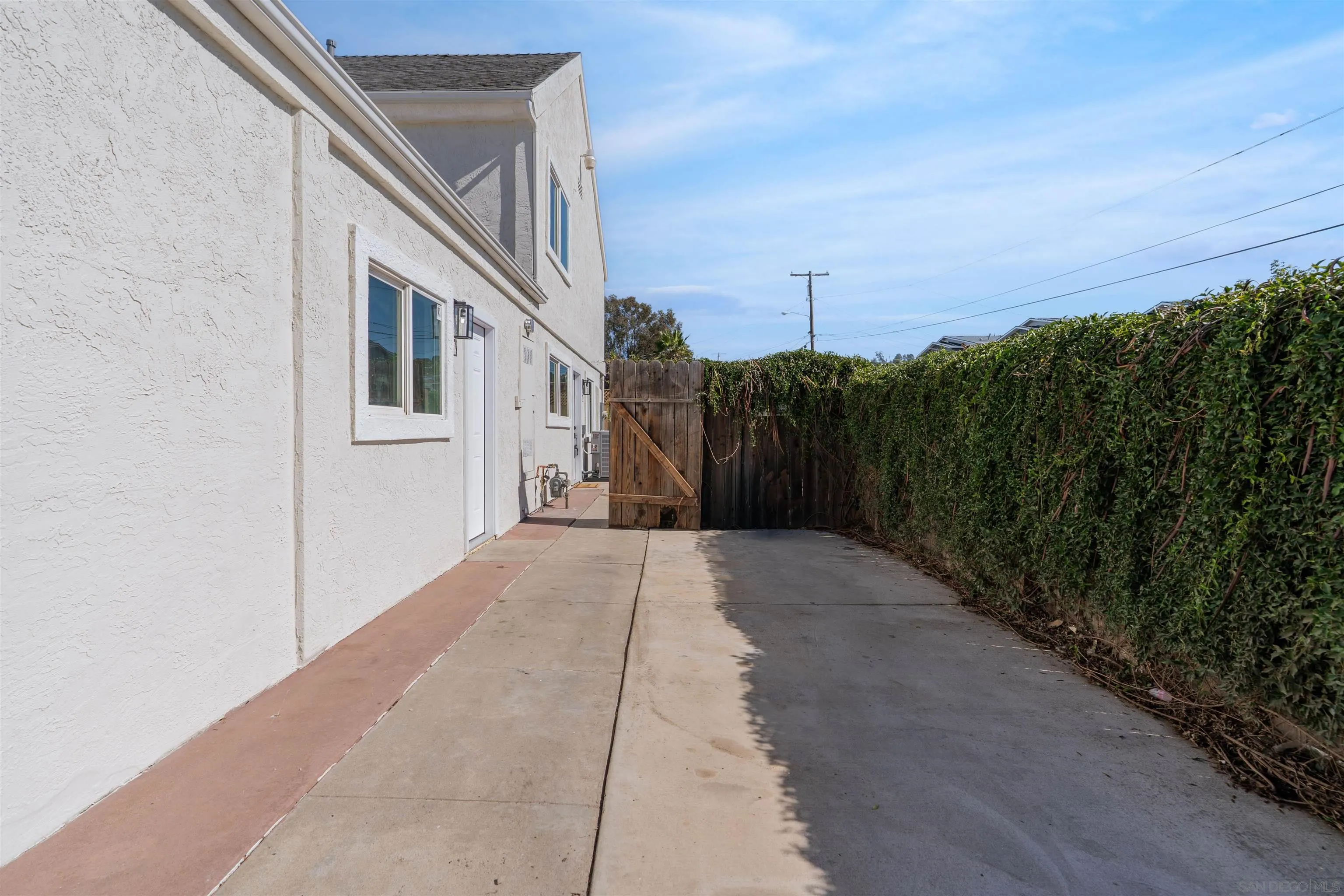 3101 King Arthurs Court Spring Valley, CA 91977 - Photo 11 of 40 a view of a grey house with a yard