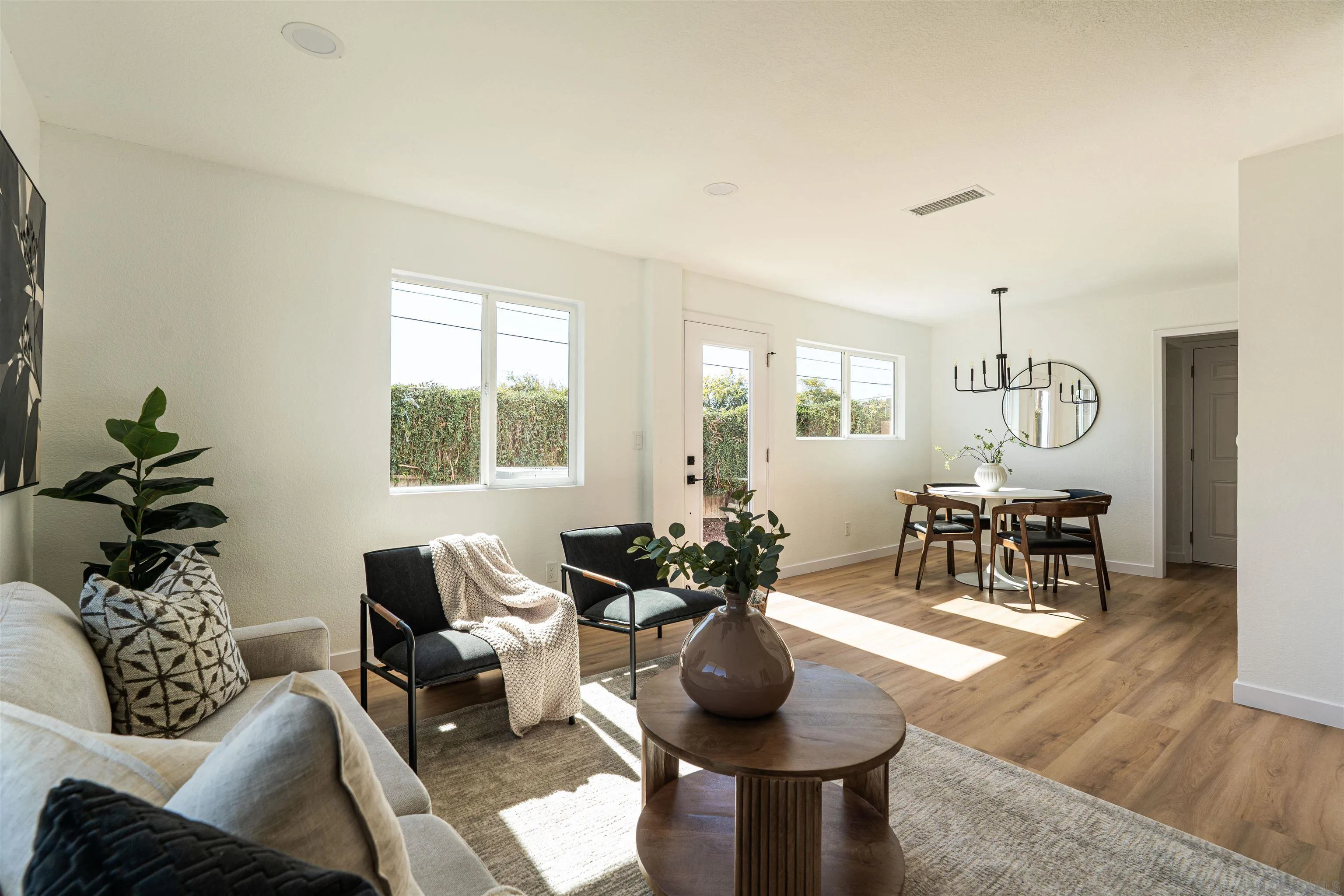3101 King Arthurs Court Spring Valley, CA 91977 - Photo 15 of 40 a living room with furniture and a chandelier
