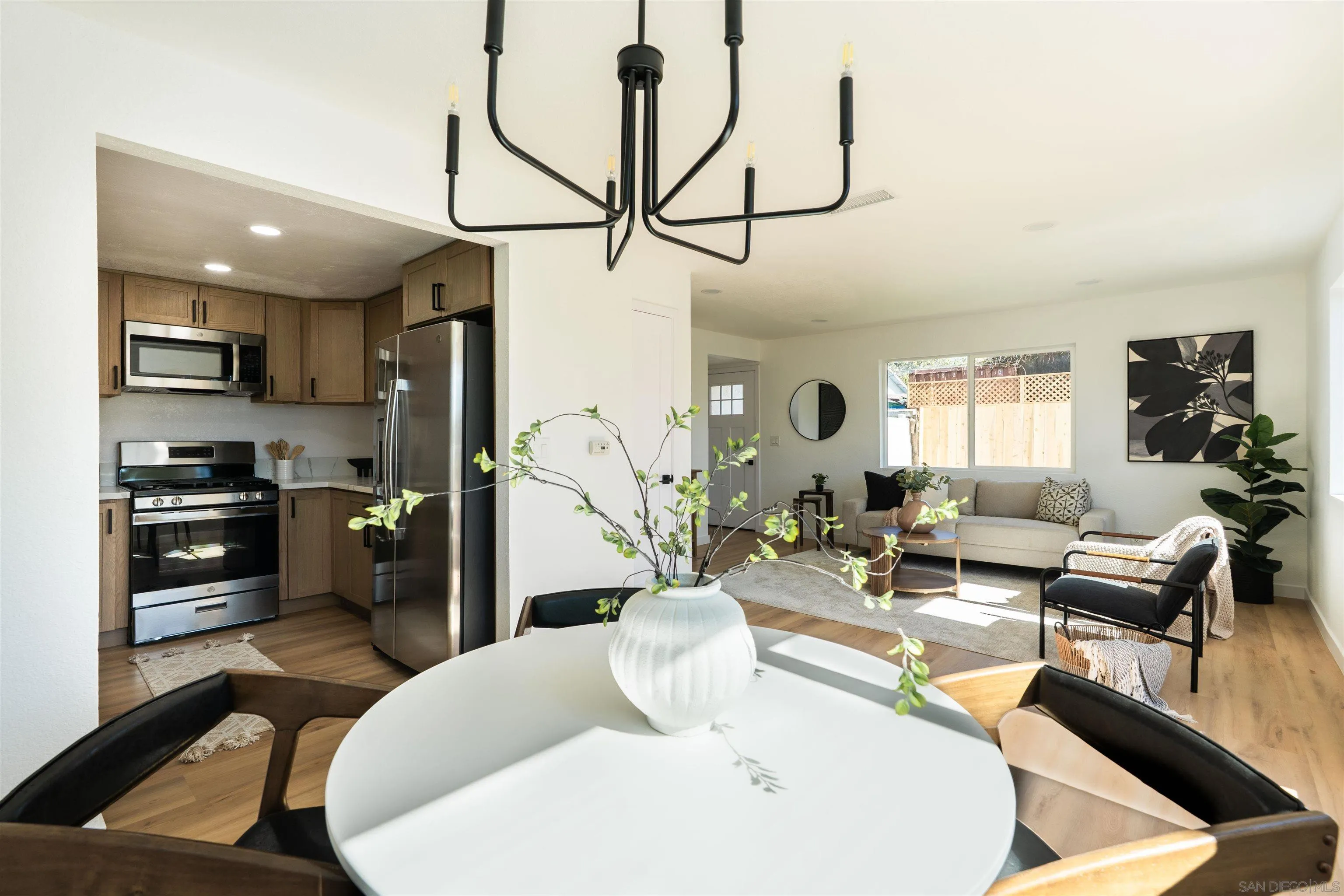 3101 King Arthurs Court Spring Valley, CA 91977 - Photo 18 of 40 a living room with stainless steel appliances furniture and a kitchen view