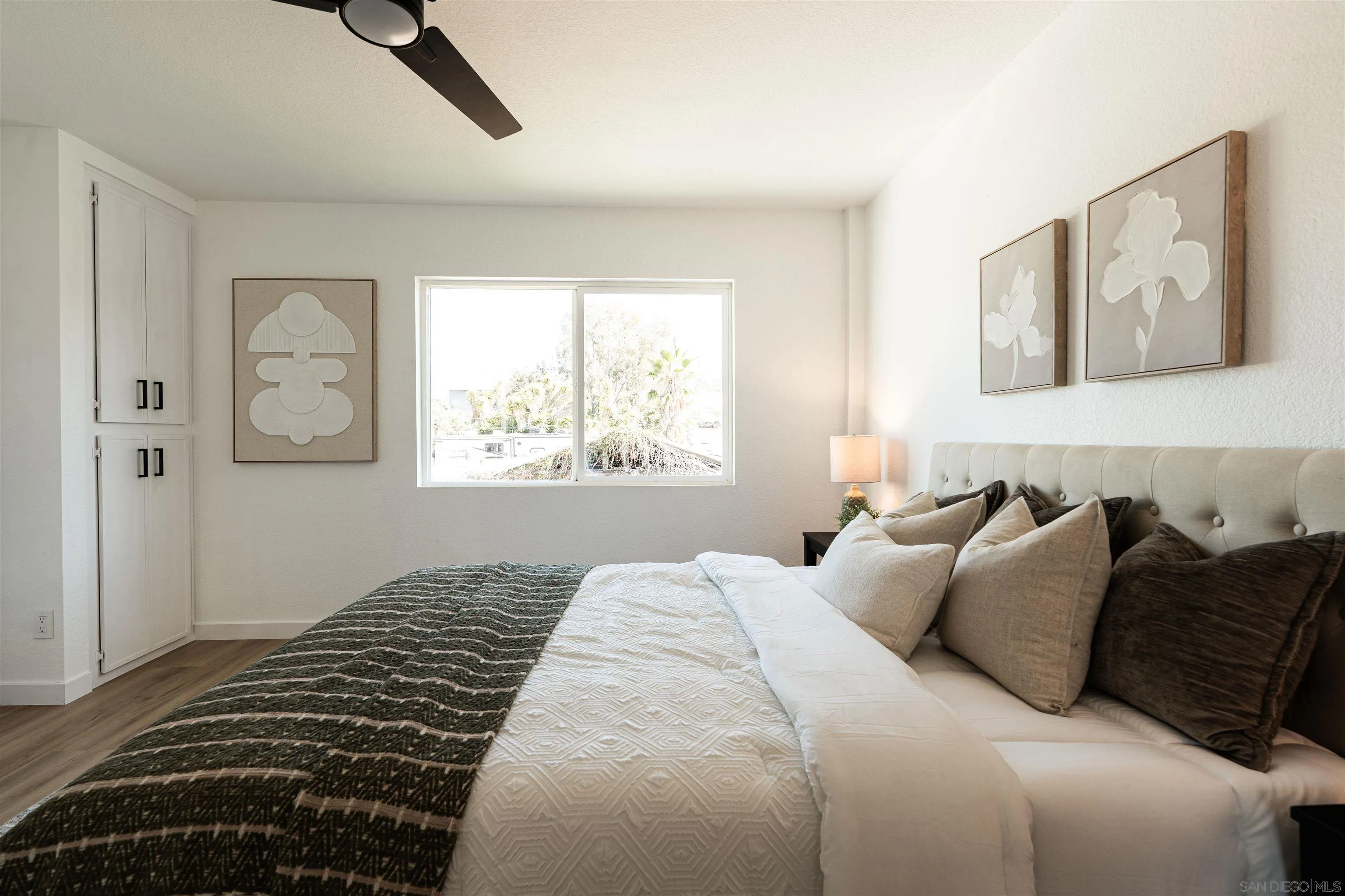 3101 King Arthurs Court Spring Valley, CA 91977 - Photo 25 of 40 a bedroom with a bed and a window