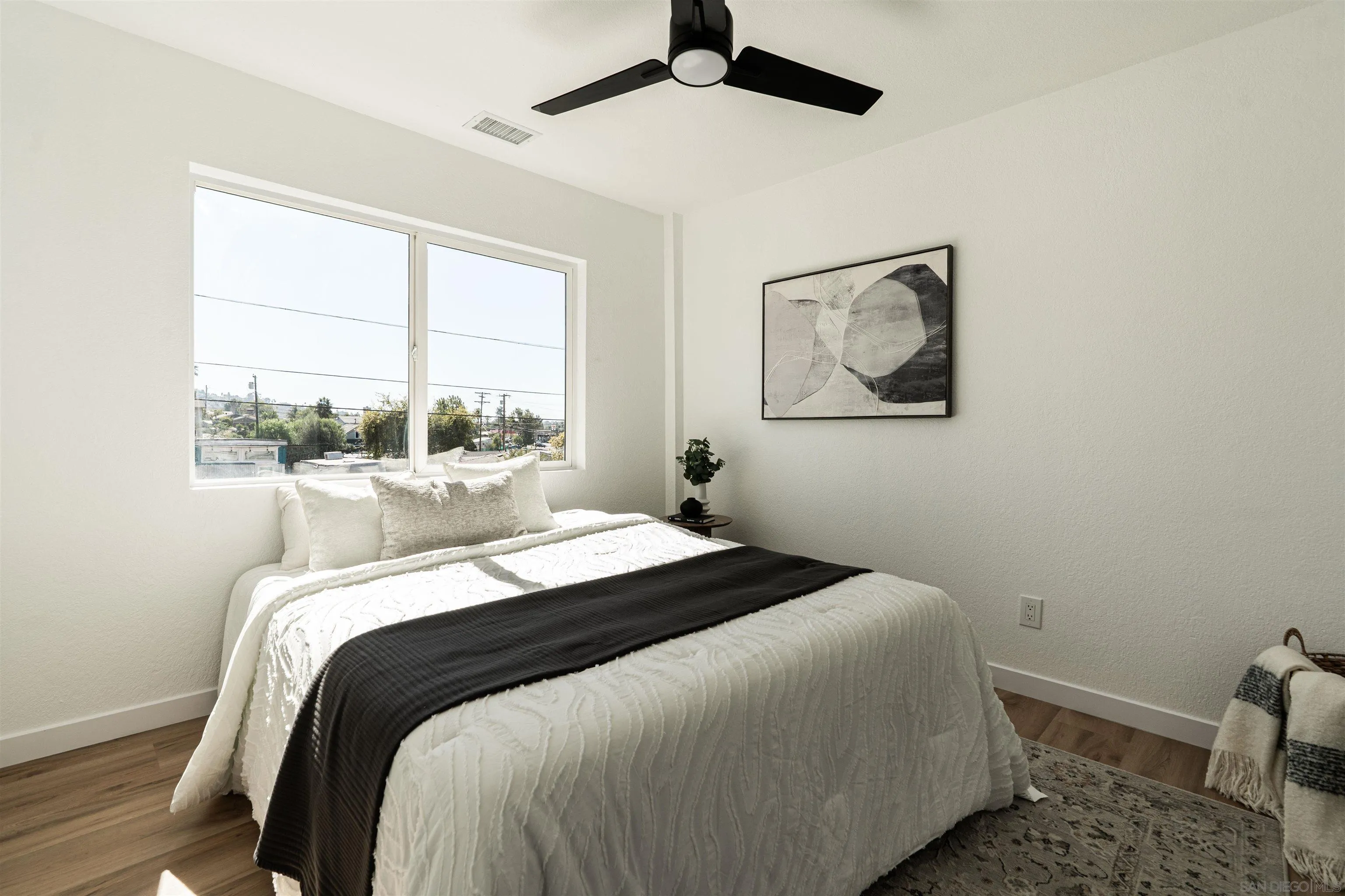 3101 King Arthurs Court Spring Valley, CA 91977 - Photo 28 of 40 a bedroom with a bed and a window