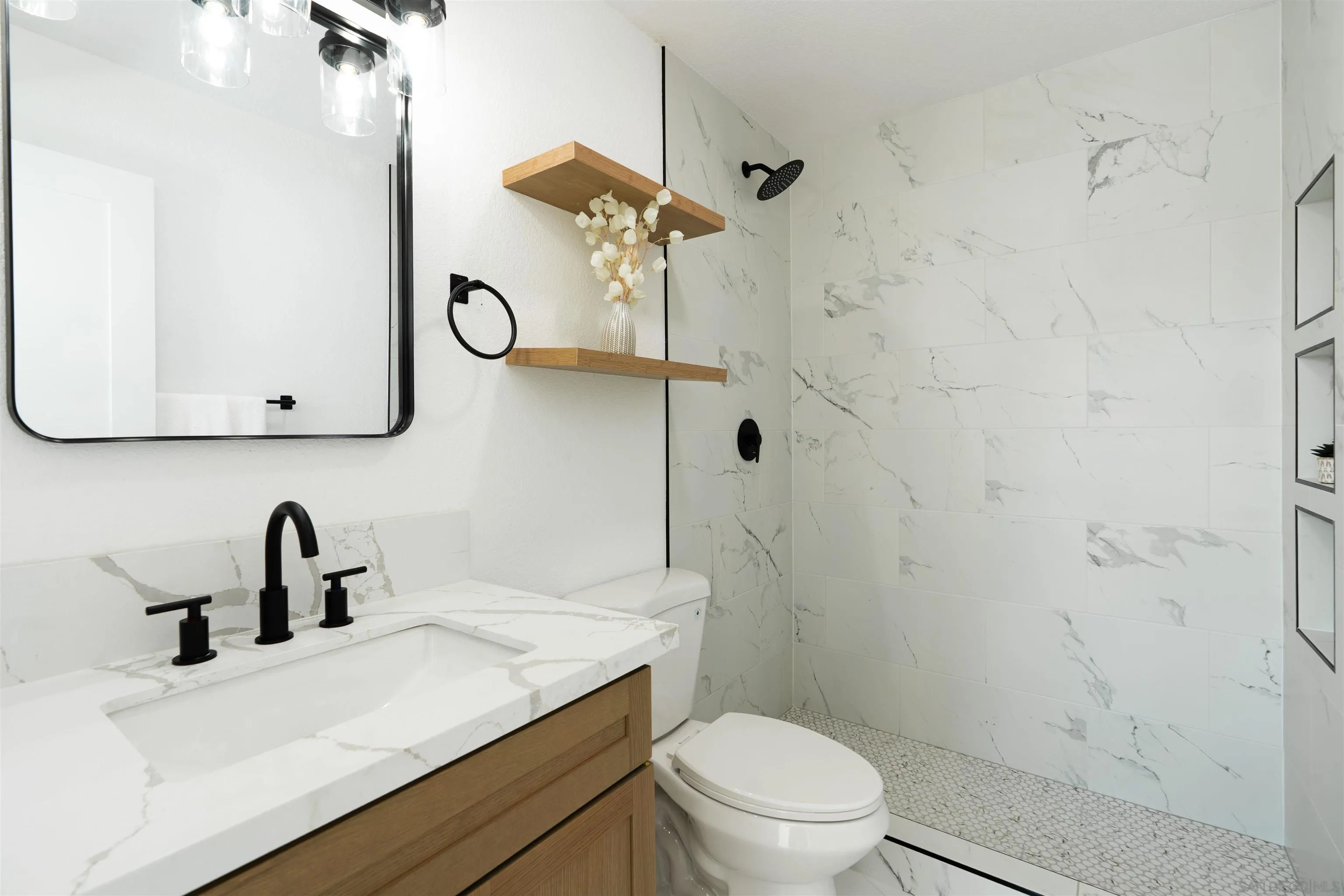 3101 King Arthurs Court Spring Valley, CA 91977 - Photo 30 of 40 a bathroom with a granite countertop sink a toilet and shower