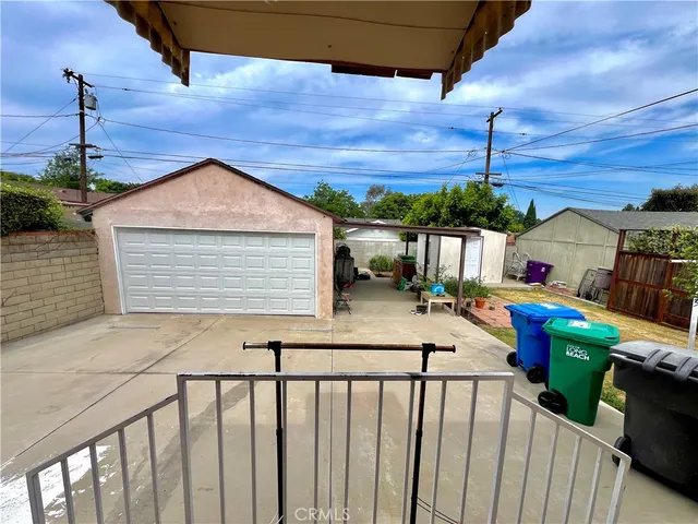 a front view of a houses with street