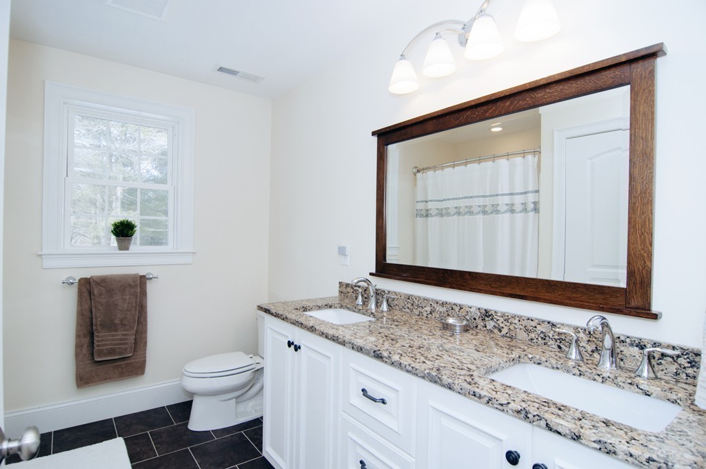 90 Cedarcrest Road Canton, MA 02021 - Photo 23 of 30 a bathroom with a granite countertop sink toilet and mirror