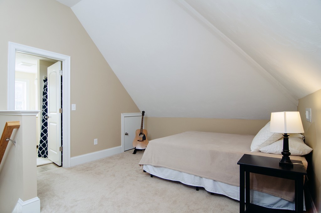 90 Cedarcrest Road Canton, MA 02021 - Photo 26 of 30 a bedroom with a bed and a lamp on table