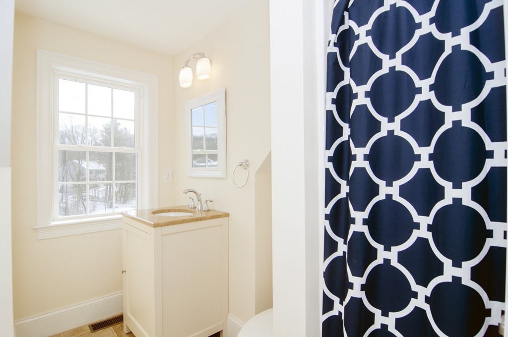 90 Cedarcrest Road Canton, MA 02021 - Photo 27 of 30 a bathroom with a granite countertop sink and a mirror