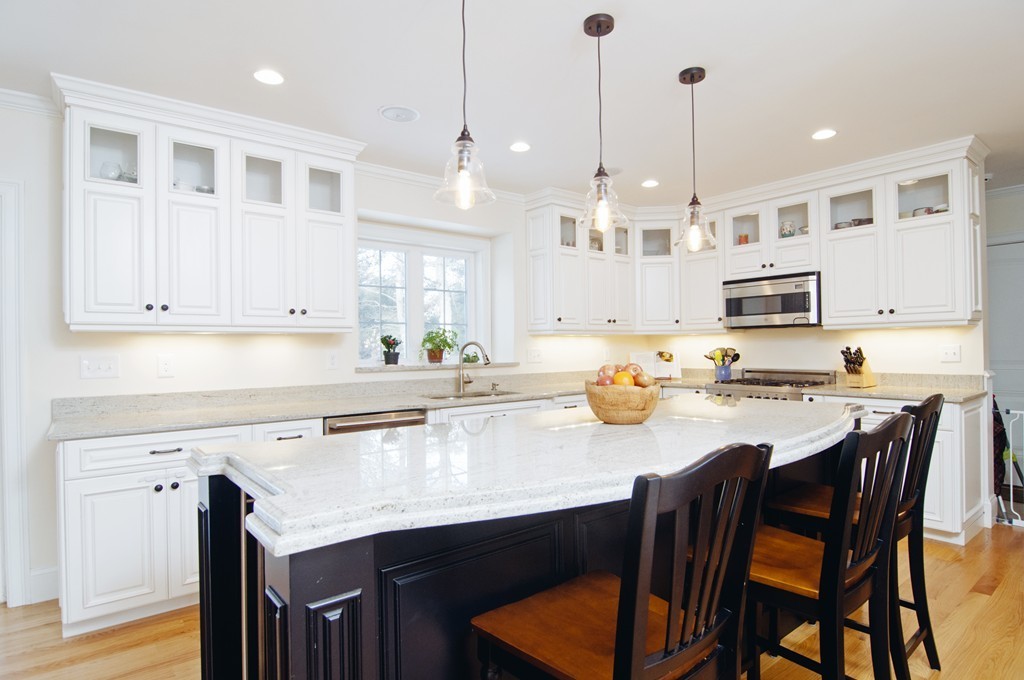 90 Cedarcrest Road Canton, MA 02021 - Photo 4 of 30 a kitchen with stainless steel appliances granite countertop a kitchen island a stove a table and chairs
