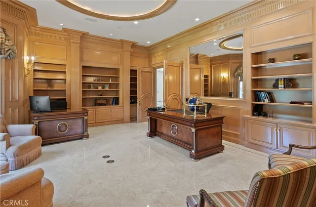 a living room with furniture and view of kitchen