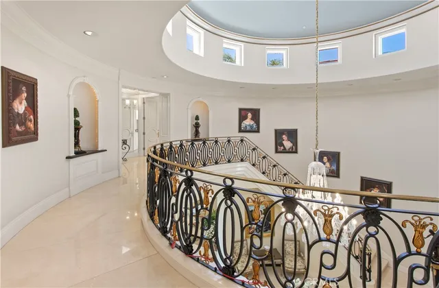 a view of a hallway with a table and chairs