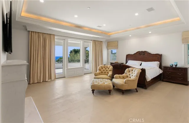 a living room with furniture and large windows