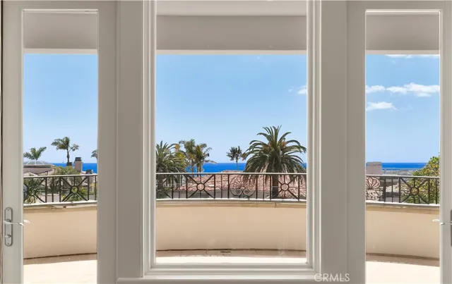 a view of living room with a bed and a potted plant