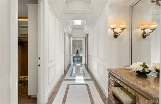a view of hallway with wooden floor