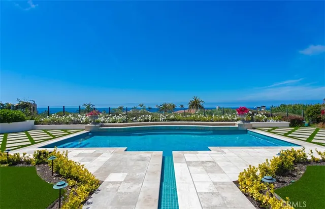 a view of a lake with a house in the background
