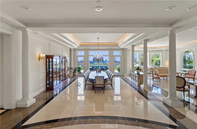 a dining room with wooden floor and large window