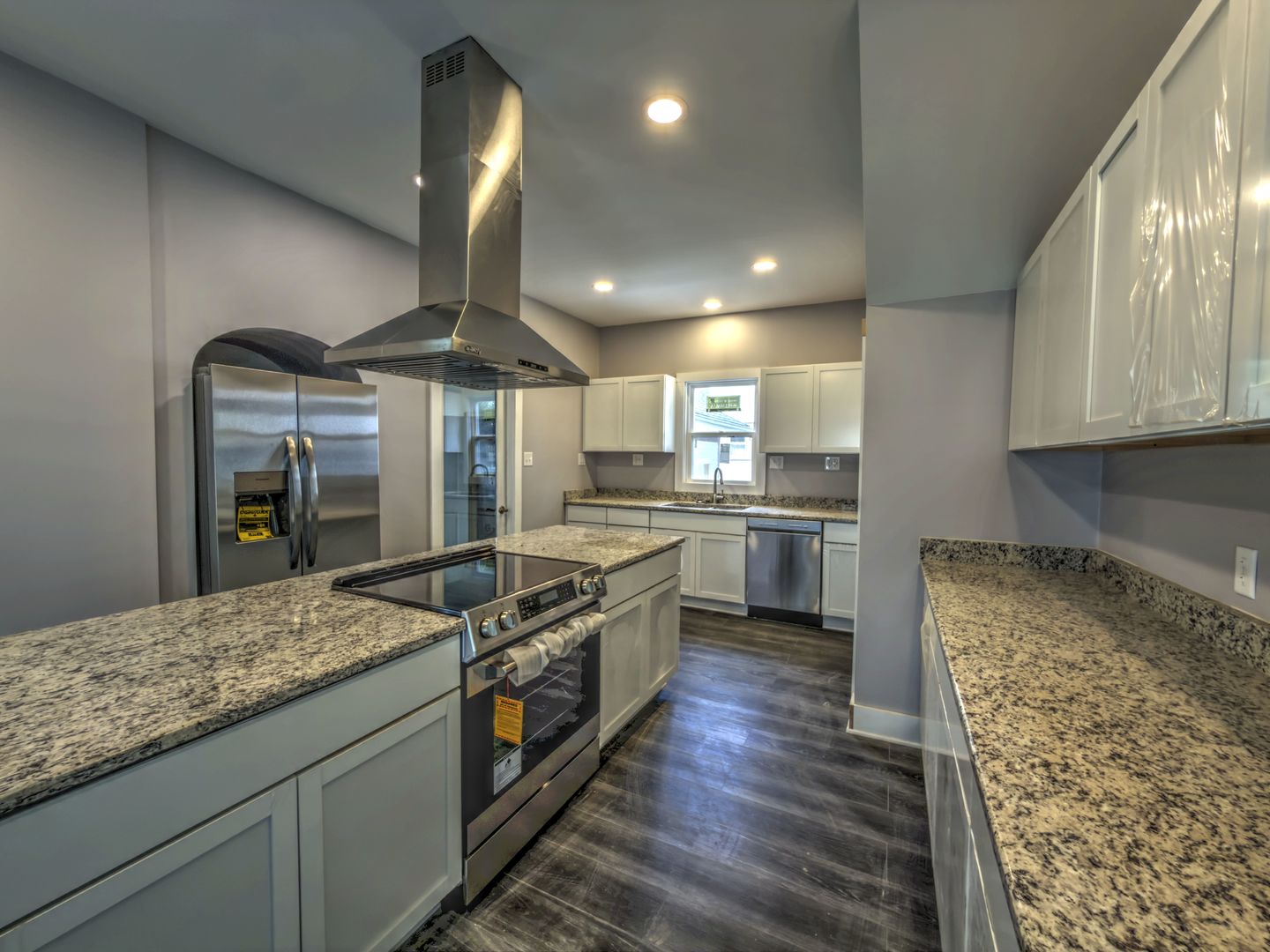 623 South 4th Street Watseka, IL 60970 - Photo 11 of 35 a kitchen with stainless steel appliances granite countertop a stove and a sink