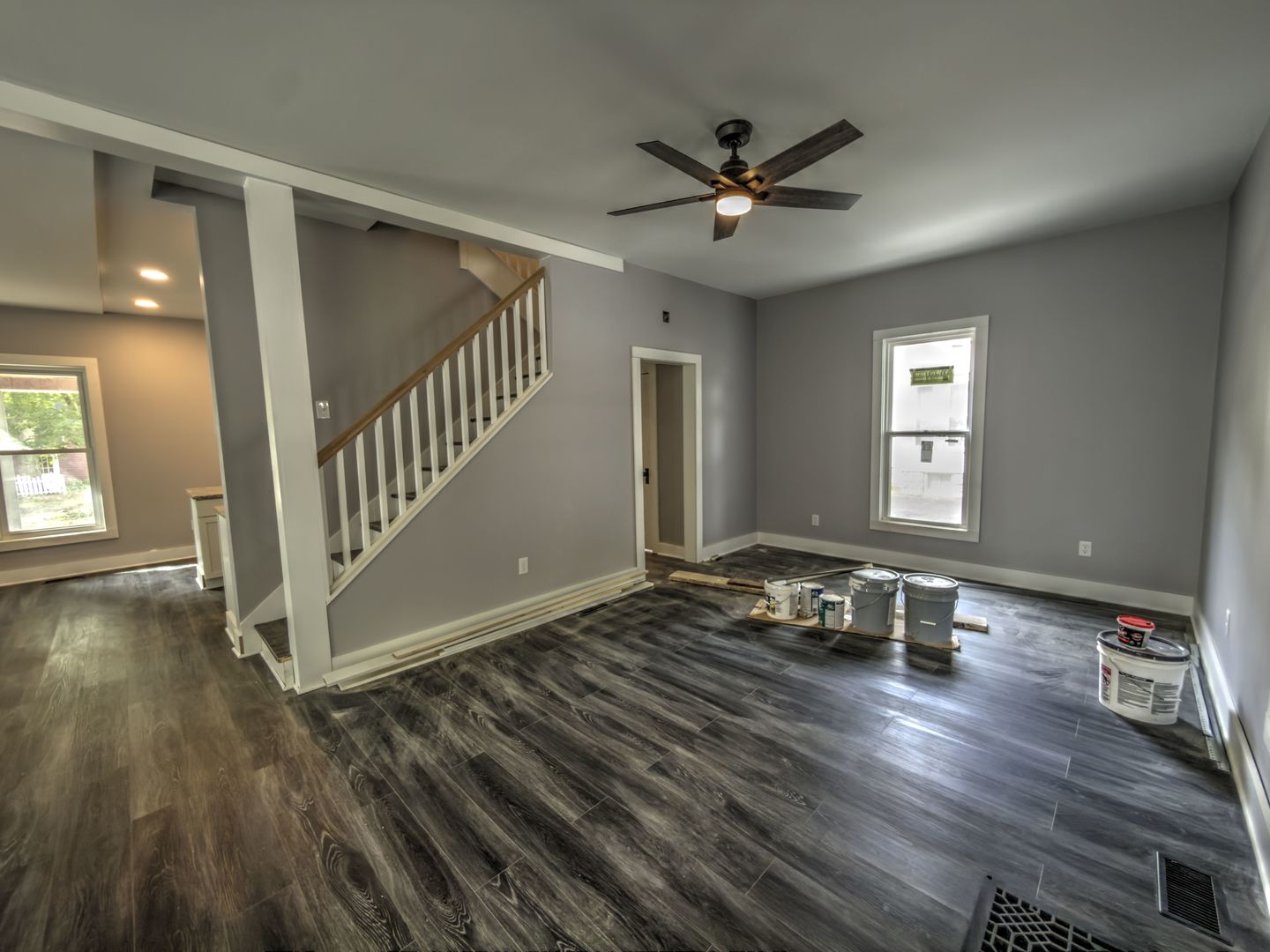 623 South 4th Street Watseka, IL 60970 - Photo 19 of 35 a view of a livingroom with wooden floor and a ceiling fan