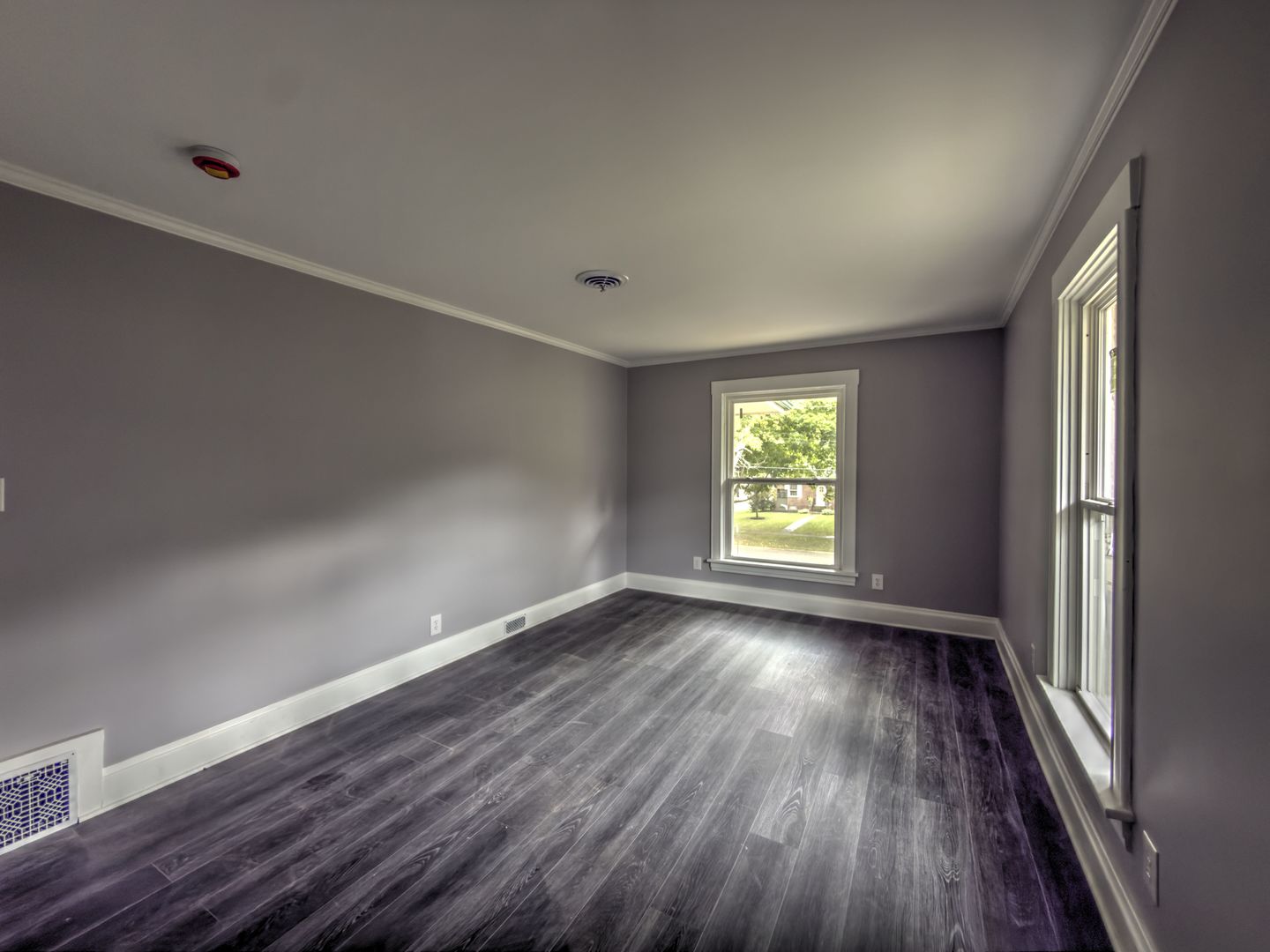 623 South 4th Street Watseka, IL 60970 - Photo 29 of 35 an empty room with wooden floor and windows