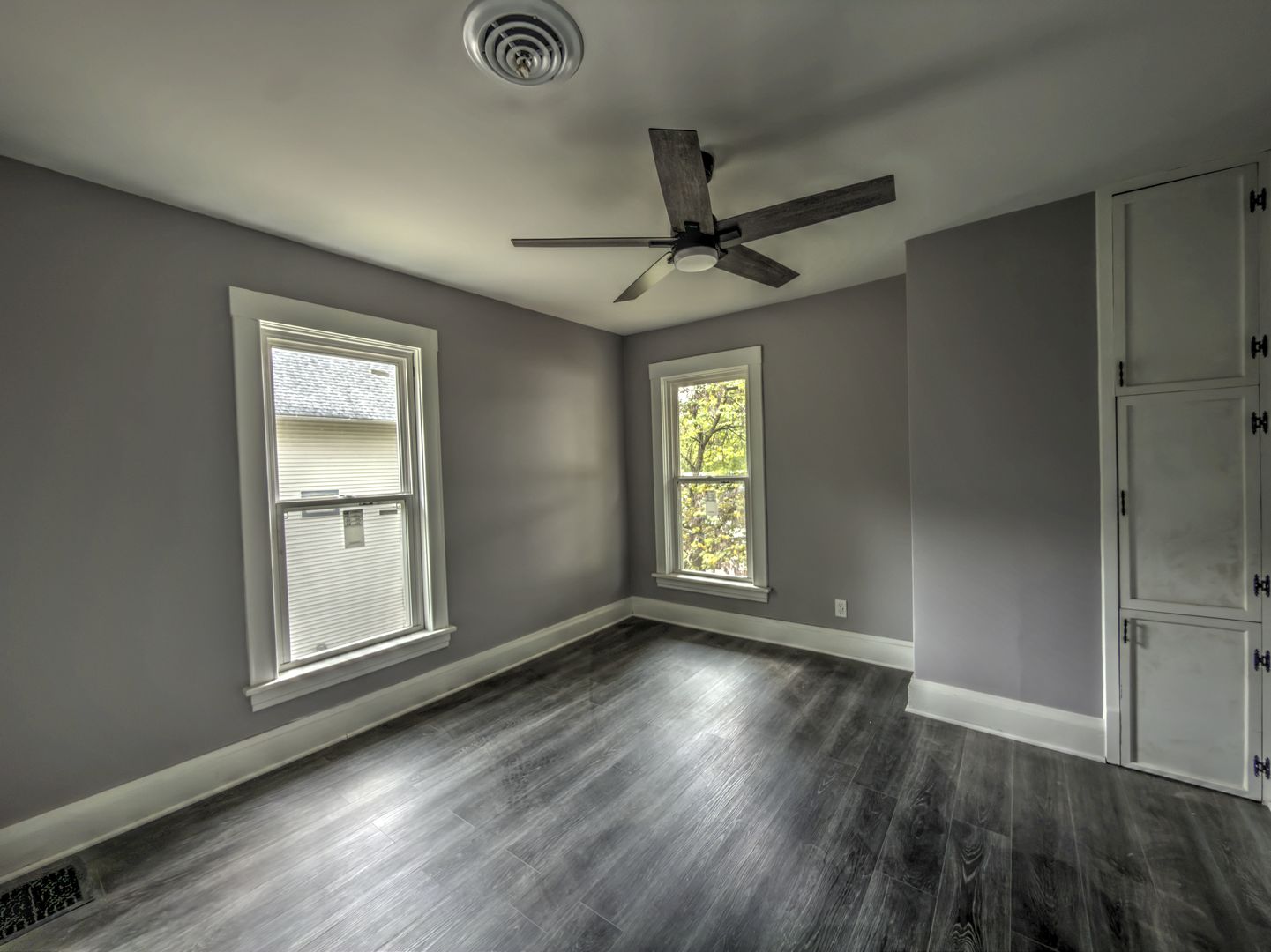 623 South 4th Street Watseka, IL 60970 - Photo 32 of 35 a view of an empty room with a window and wooden floor