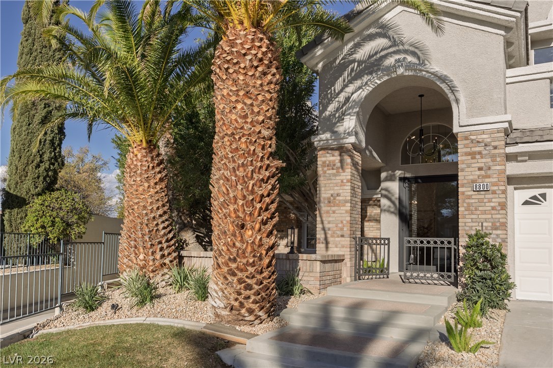 8800 Lusso Las Vegas, NV 89134 - Photo 16 of 85 View of exterior entry with stucco siding and brick siding