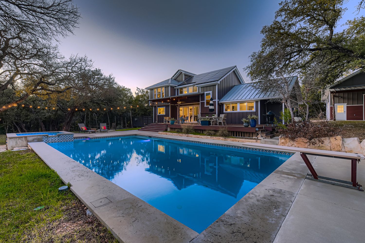 a view of a swimming pool with outdoor seating